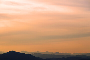 Fototapeta na wymiar Sunset sky and silhouette mountains