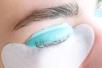 Young woman receiving eyelash lamination procedure - obrazy, fototapety, plakaty