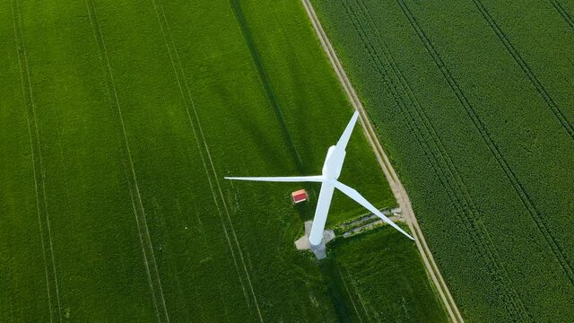 Wind turbine on a windless day. The broken wind turbine doesn't work under the wind, Wind turbine blades stopped turning because there Is no wind, Poland Puck