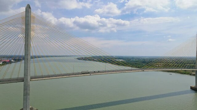 Few Vehicles Passing By The Tsubasa Bridge Across Mekong River During Pandemic In Kandal Province, Cambodia. arc drone shot