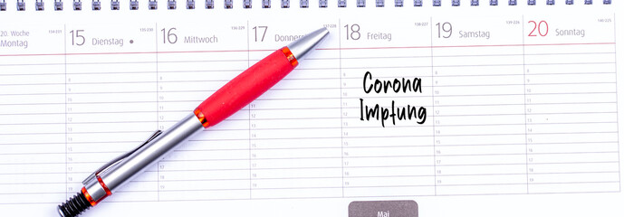 Kalender mit einem Eintrag Corona Impfung