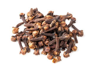 pile of dried cloves closeup on white