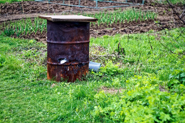 Fototapeta premium old iron barrel in the garden
