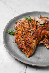 Closeup view of pulled lamb shoulder meat baked in oven with potato and carrot