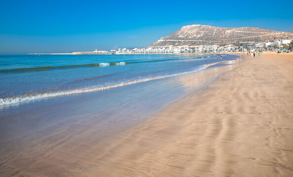 Agadir beach on the Atlantic African coast in the summertime with yellow sand and turquoise water in Morocco