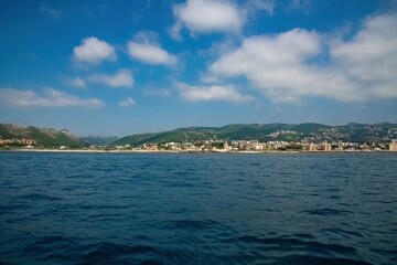Lebanon city of Batroun viewed from the sea in a distance