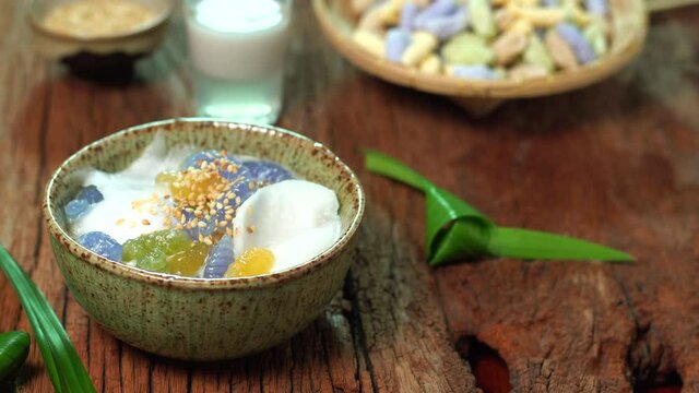 Delicious traditional thai dessert Caramelized crisps in coconut milk, Sprinkled with roasted white sesame seeds. Thai desserts homemade also called Krong-Kraeng. Shooting in studio for advertisement 