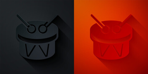 Paper cut Musical instrument drum and drum sticks icon isolated on black and red background. Paper art style. Vector