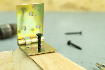 The self-tapping screw is screwed into the board