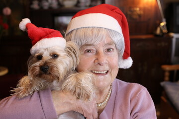 Senior woman and her dog during Christmas time