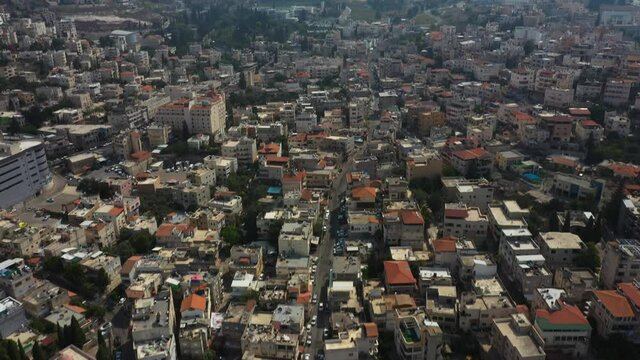 flying over a mosk during the day a beautiful landscape