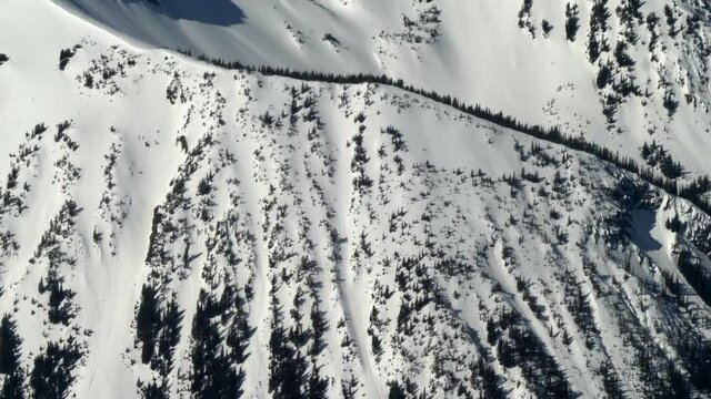 Bird's Eye View Of The Snow-Covered Peak Of The Mountains In South Chilcotin Mountains Provincial Park. aerial