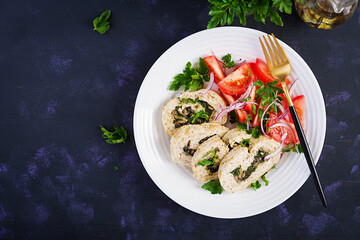 Meatloaf roll stuffed with spinach, olives, mushrooms and tomatoes salad. Diet menu. Top view, flat lay