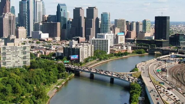 Aerial view of Schuylkill River bridge and highway. Drone shot reveals Philadelphia skyscrapers