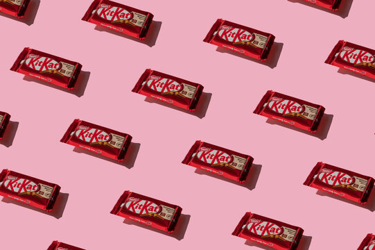 Krakow, Poland - 13 May 2021. Pattern of Kitkat chocolate on pink background.