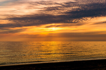 Sunset over ocean. Summer evening.