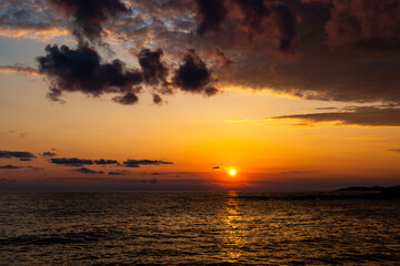 Sunset over sea. Dramatic sky.