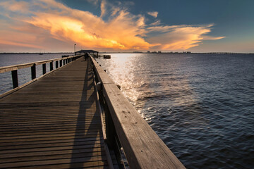 Fototapeta na wymiar Melbourne beach pier at sunset with Heron birds