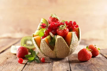 Rolgordijnen fresh fruit salad with melon and berries fruits © M.studio