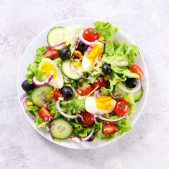 vegetable salad with cucumber,  egg and tomato