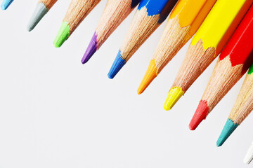 Top down view of neatly arranged tips of colored pencils.
