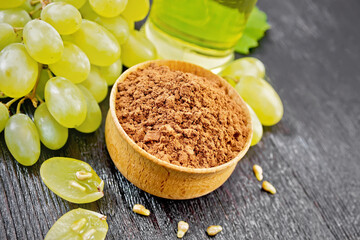 Flour grape seed in bowl on wooden board