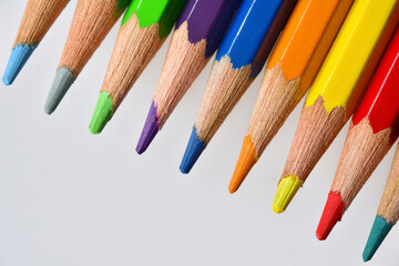 Top down view of neatly arranged tips of colored pencils.