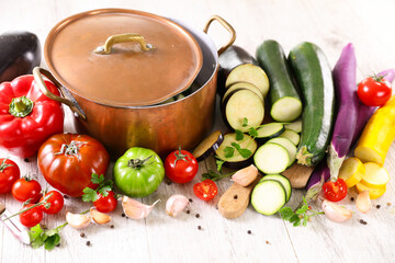 cooking pot and vegetables and spices