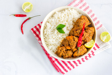 Indian Style Stir-Fried Chicken and Rice in a Bowl Directly Above Photo