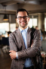 Fototapeta premium Portrait of handsome businessman. Young man working in the office