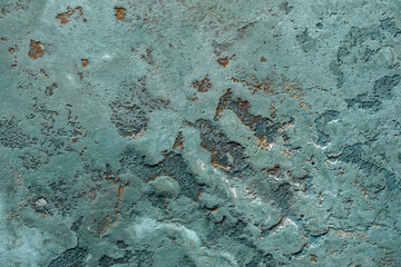 Abstract ocean blue clay wall texture background with imperfections and cracks.
