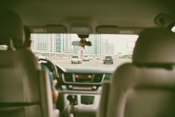 the driver is driving in the city traffic