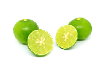 Obraz na płótnie Canvas Vibrant green fresh limes isolated on white background