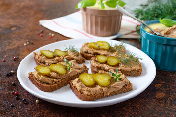 Rye bread with turkey liver pate and pickled cucumbers. Delicious appetizer.