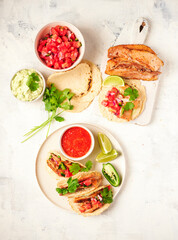 Taco with slow-cooked pork breast, pico de gallo, salsa roja, avocado cream