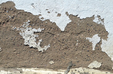 Background of an old destroyed concrete wall with damage