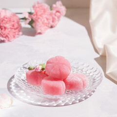 Mochi pink on a white table in a plate
