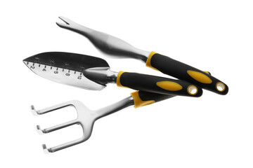 Fototapeta premium Trowel, weeder and pitchfork on white background, top view. Gardening tools