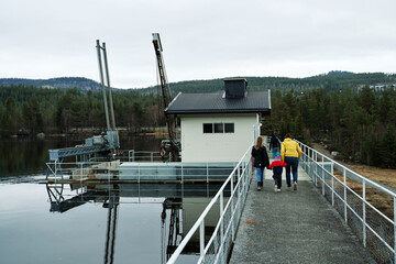 On a large dam. The water level is high due to spring and a lot of melting snow from the mountains. 