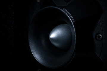 Side view, High-pitched speaker in the dark, close up