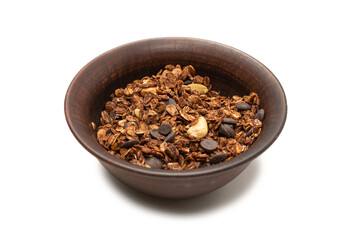 Chocolate granola cereal with nuts in a bowl background.