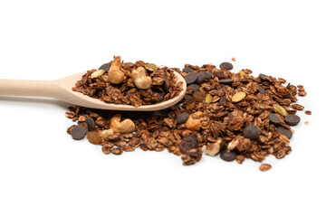 Chocolate granola cereal with nuts in a wooden spoon.