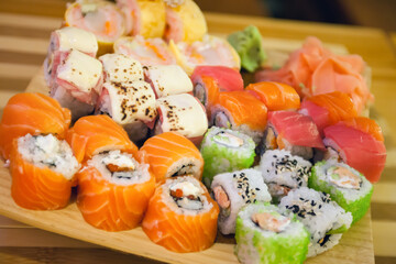 Assorted rolls are laid out on the board. Japanese cuisine - 434115541