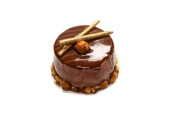 Chocolate and caramel cake isolated on a white background.