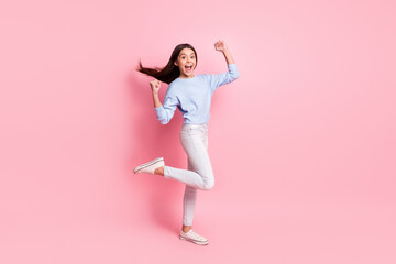 Fototapeta na wymiar Full length body size profile side view of nice amazed cheerful girl having fun rejoicing isolated over pink pastel color background