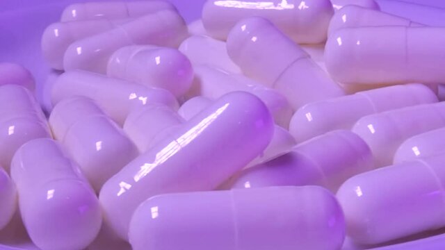 Pharmaceutical capsules drugs. Detailed video.