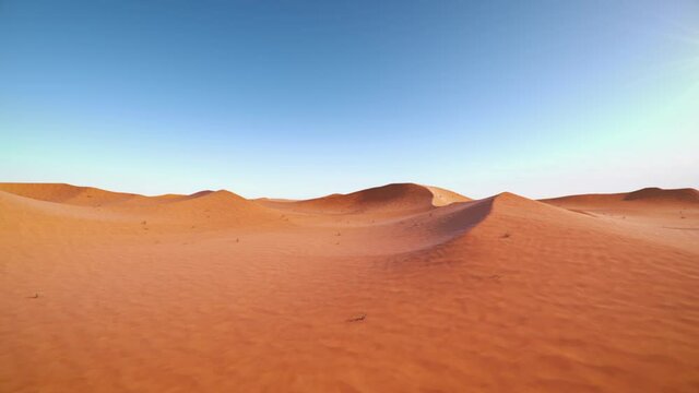 Camera is flying through a red desert - dunes around