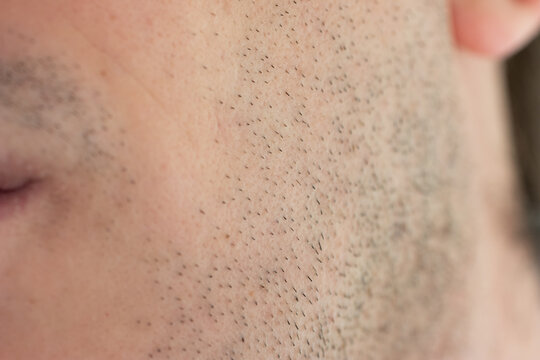 Caucasian male short unshaven facial hair stubble macro close up shot unrecognizable face