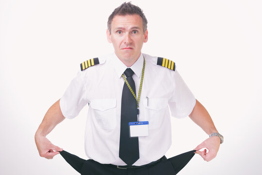 Airline captain pilot showing his empty pockets