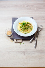 Spaghetti with vegan carbonara and broad beans (ph. Archivio Collection)